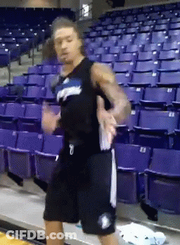 A Basketball Player With The Number 7 On His Shorts Is Dancing GIF