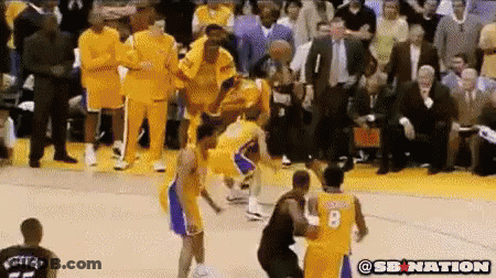 A Basketball Player With The Number 8 On His Jersey Is Being Fouled GIF