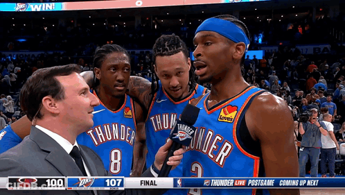 A Basketball Player With The Number 8 On His Jersey Is Being Interviewed GIF