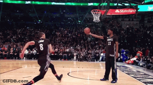 A Basketball Player With The Number 8 On His Jersey Is Jumping In The Air GIF