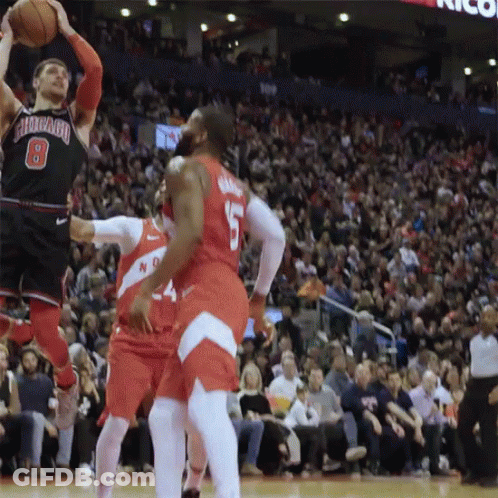 A Basketball Player With The Number 8 On His Jersey Is Jumping To Catch The Ball GIF