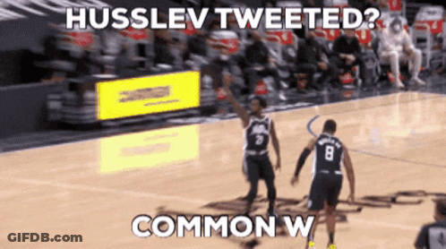 A Basketball Player With The Number 8 On His Jersey Is Talking To Another Player GIF