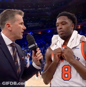 A Basketball Player With The Number 8 On His Jersey Talks To A Reporter GIF