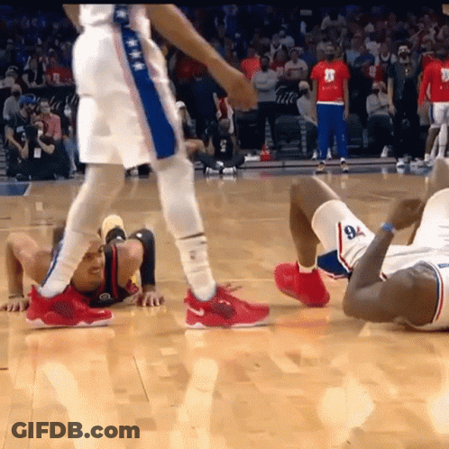 A Basketball Player With The Number 8 On His Shorts Is Crawling On The Floor GIF
