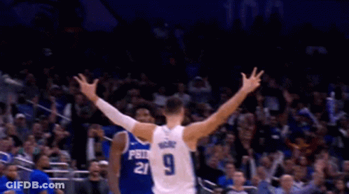 A Basketball Player With The Number 9 On His Back Is Celebrating GIF