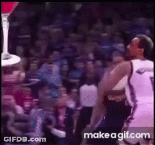 A Basketball Player With The Number 9 On His Jersey Is Jumping In The Air GIF