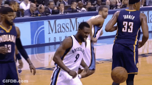 A Basketball Player With The Number 9 On His Jersey Is Running On The Court GIF