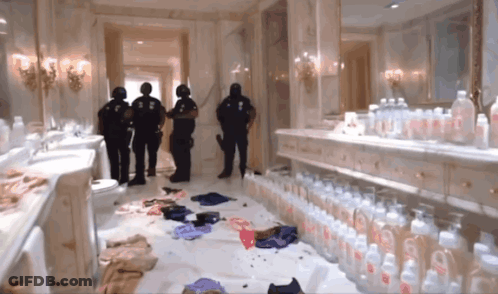A Bathroom With A Lot Of Baby Bottles And A Few Police Officers GIF