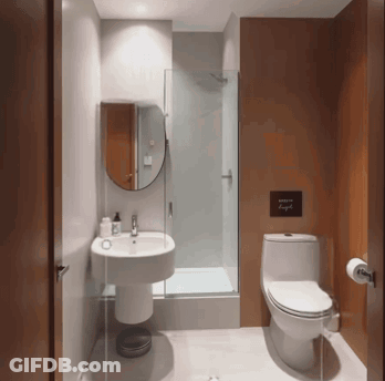 A Bathroom With A Sign Above The Toilet That Says " Where We Laugh " GIF