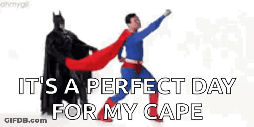 A Batman And Superman Are Standing Next To Each Other . GIF