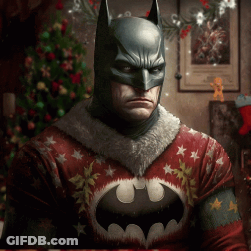 A Batman Wearing An Ugly Christmas Sweater GIF