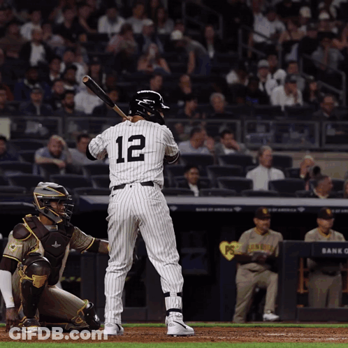 A Batter With The Number 12 On The Back Of His Jersey GIF