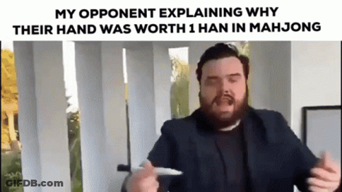 A Bearded Man In A Suit Is Explaining Why Their Hand Was Worth 1 Han In Mahjong . GIF
