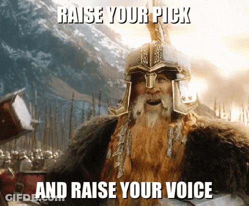 A Bearded Man Wearing A Helmet With The Words Raise Your Pick And Raise Your Voice Below Him GIF