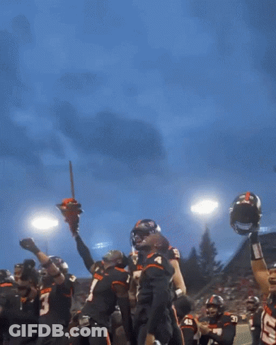 A Beaver Football Player Holds Up A Chainsaw In His Hands GIF