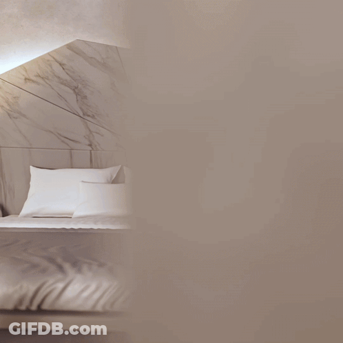 A Bed With A Marble Headboard And A Nightstand That Says ' A ' On It GIF
