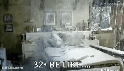A Bedroom With A Bed , Nightstands , And A Window With The Words 32 Be Like GIF
