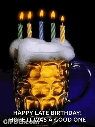 A Beer Mug With Candles On Top Of It . GIF