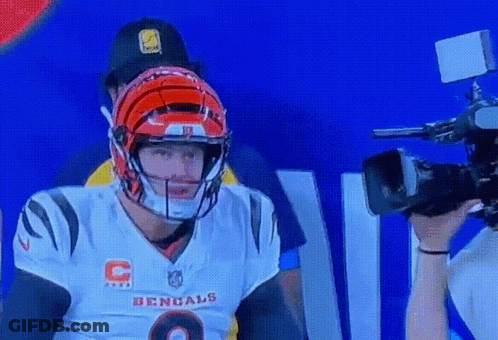 A Bengals Football Player Wearing A Helmet And A Jersey GIF