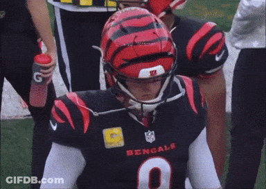 A Bengals Player Wearing A Black Jersey With The Number 9 GIF