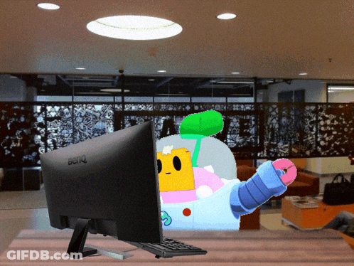 A Benq Computer Monitor With A Cartoon Character Behind It GIF