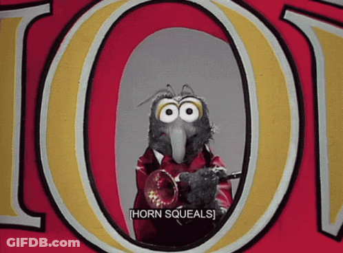 A Bird Playing A Trumpet In Front Of The Letter O. GIF