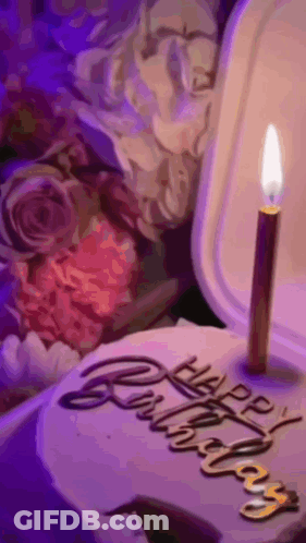 A Birthday Cake With A Candle And The Words Happy Birthday Written On It GIF