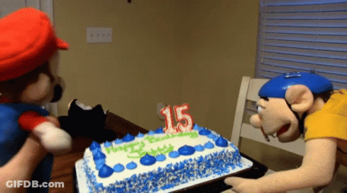A Birthday Cake With A Candle That Says 15 GIF