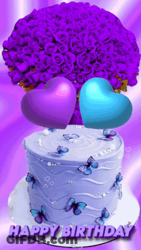 A Birthday Cake With Butterflies And Purple Roses On It GIF