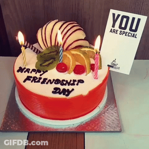 A Birthday Cake With Candles And A Card That Says " You Are Special " GIF