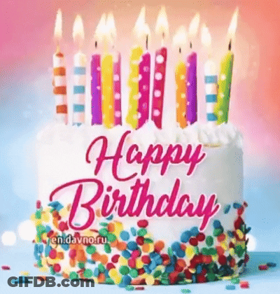 A Birthday Cake With Candles And Sprinkles On It . GIF