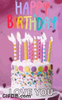 A Birthday Cake With Candles And Sprinkles On It And The Words `` Happy Birthday , Love You '' . GIF