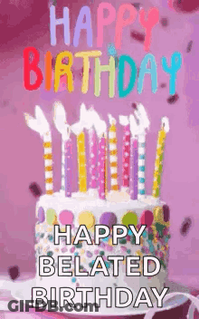 A Birthday Cake With Candles On It And The Words `` Happy Belated Birthday '' Written On It . GIF