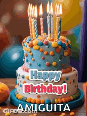 A Birthday Cake With Candles On It And The Words Happy Birthday Amiquita On It GIF