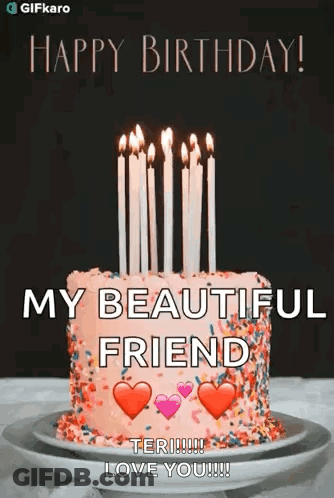 A Birthday Cake With Candles On It Is On A Plate On A Table . GIF