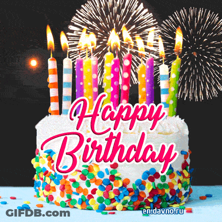 A Birthday Cake With Fireworks In The Background And The Words Happy Birthday GIF