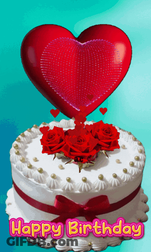 A Birthday Cake With Red Roses And A Red Heart On Top GIF