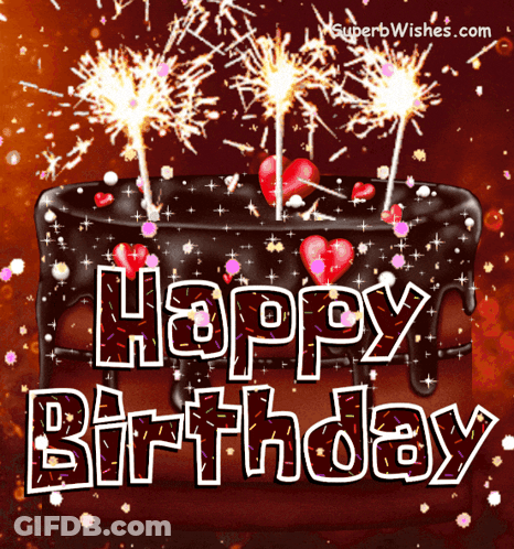 A Birthday Cake With Sparklers And The Words Happy Birthday Written On It GIF