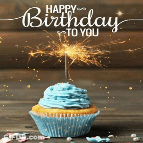 A Birthday Card With A Cupcake And A Sparkler GIF