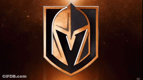 A Black And Gold Shield With A Spartan Helmet On It GIF