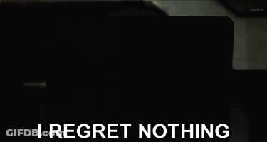 A Black And White Anime Character With The Words I Regret Nothing GIF