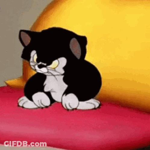 A Black And White Cartoon Cat Is Sitting On A Pink Pillow . GIF