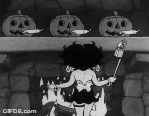 A Black And White Cartoon Of Betty Boop Standing Next To A Fireplace GIF