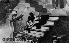 A Black And White Cartoon Of Mickey Mouse Sitting On A Set Of Stairs Next To A Skeleton . GIF