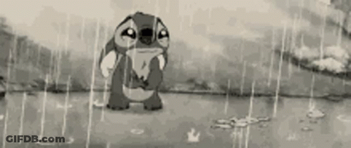 A Black And White Cartoon Of Stitch Crying In The Rain GIF