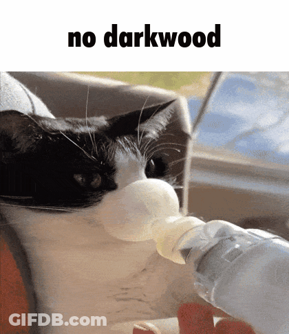 A Black And White Cat Drinking From A Bottle With The Words " No Darkwood " Above It GIF