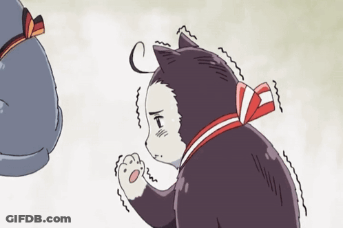 A Black And White Cat With A Red Bow Around Its Neck Is Standing Next To Another Cat GIF