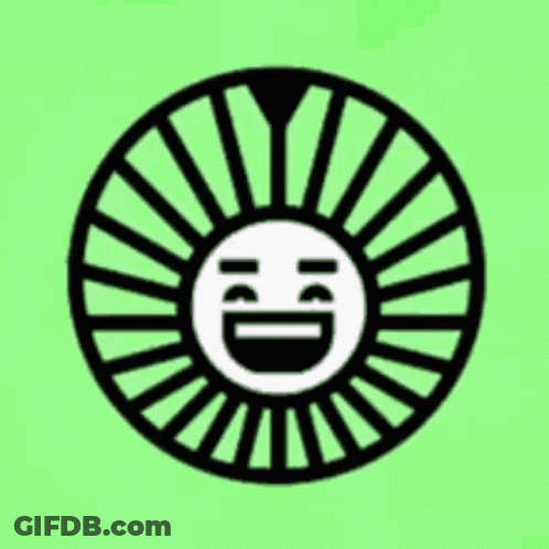 A Black And White Circle With A Smiley Face In The Middle On A Green Background . GIF