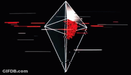 A Black And White Diamond With A Red Center GIF