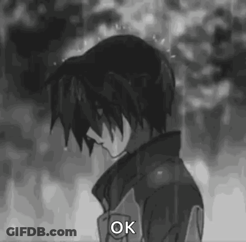 Black And White Boy Standing In Rain Saying Ok GIF